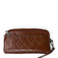 Sina Footwear brown genuine leather wallet with quilted stitching and zippered compartments.
