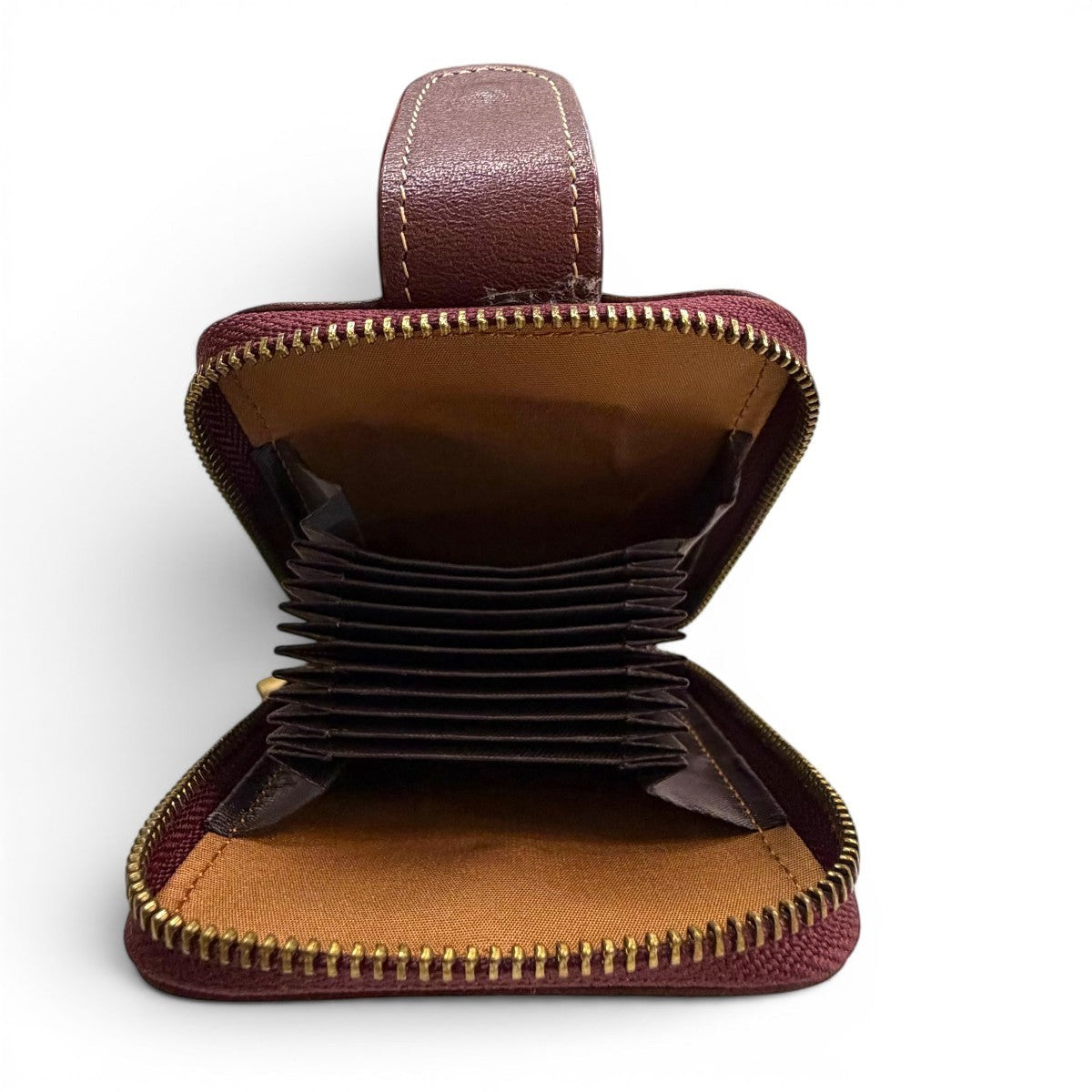 Sina Footwear genuine leather wallet in burgundy with multiple card slots and zippered closure.