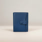 Sina Footwear dark blue genuine leather bi-fold wallet with snap closure and card slots.