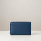 Sina Footwear dark blue genuine leather bi-fold wallet with multiple card slots and zippered coin pocket.