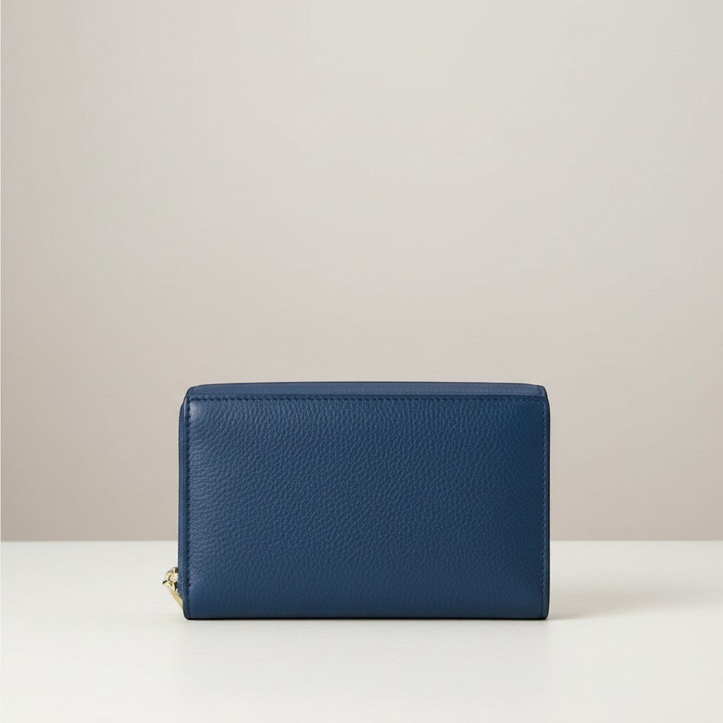 Sina Footwear dark blue genuine leather bi-fold wallet with multiple card slots and zippered coin pocket.