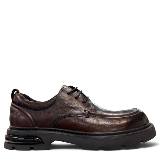 Sina Footwear dark brown leather derby shoe with a chunky black lug sole and lace-up closure.
photo of the right side