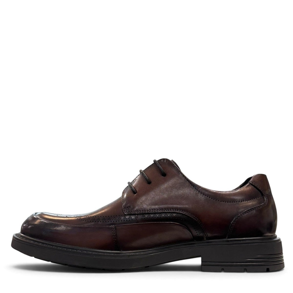 Sina Footwear dark brown leather derby shoe with brogue-inspired perforated details and a lightweight chunky sole.
 photo of the left side