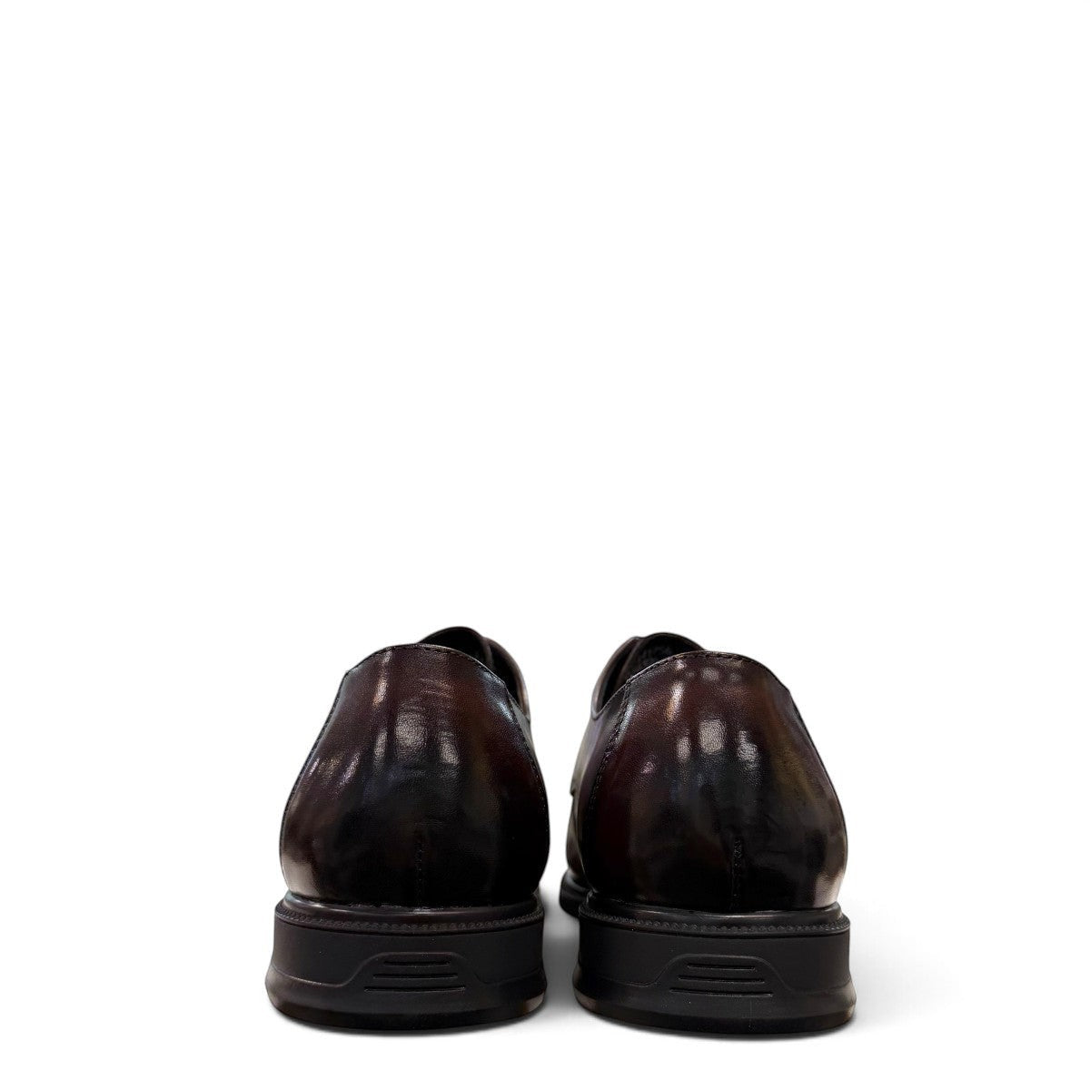 Sina Footwear dark brown leather derby shoe with apron-toe construction and lace-up design on a white background.
photo of the back side