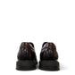 Sina Footwear dark brown leather derby shoe with brogue-inspired perforated details and a lightweight chunky sole.
 photo of the back side