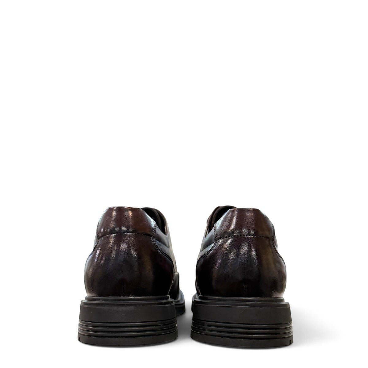 Sina Footwear dark brown leather derby shoe with brogue-inspired perforated details and a lightweight chunky sole.
 photo of the back side