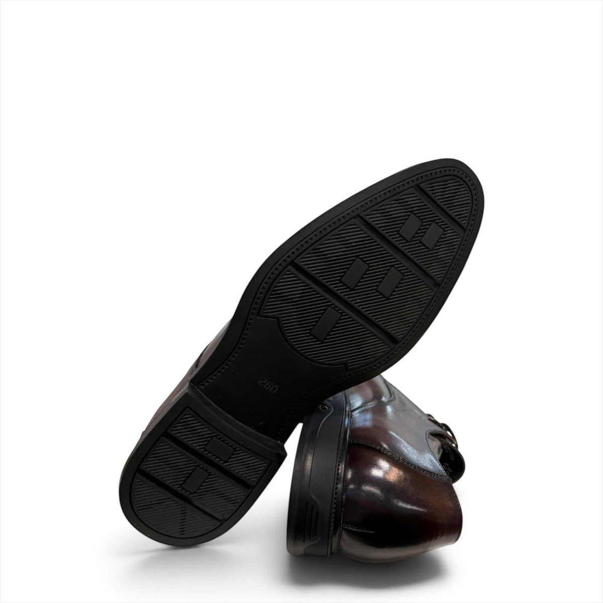 Sina Footwear dark brown leather derby shoe with apron-toe construction and lace-up design on a white background.
photo of the bottom side