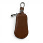Sina Footwear dark brown pebbled leather key holder wallet with zipper closure and silver hardware.