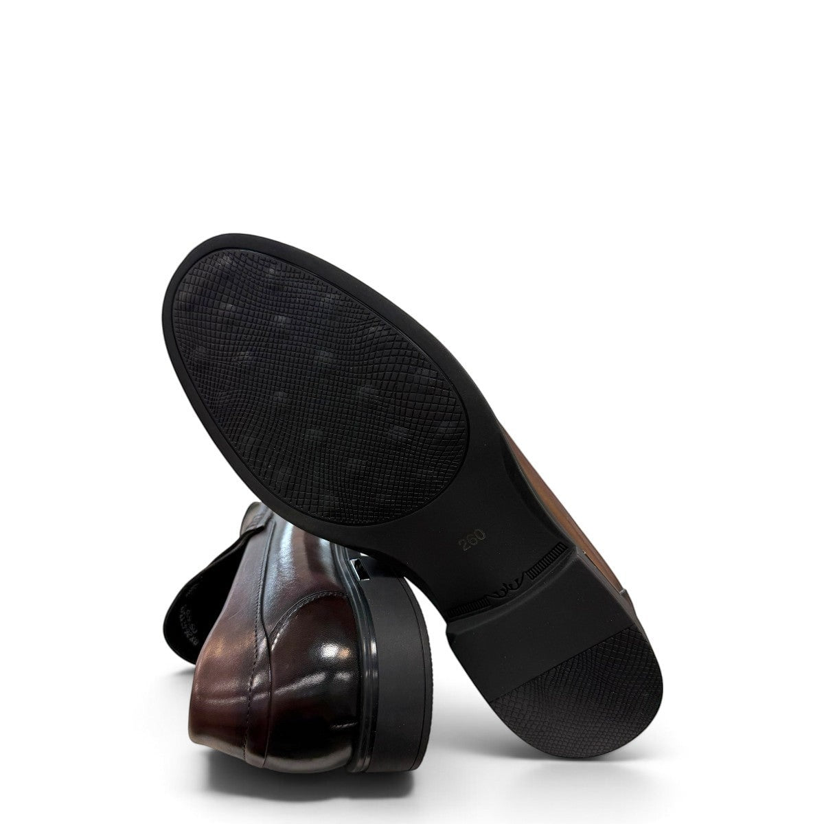 Sina Footwear dark brown genuine leather penny loafer with a classic silhouette and durable rubber outsole.
photo of the bottom side