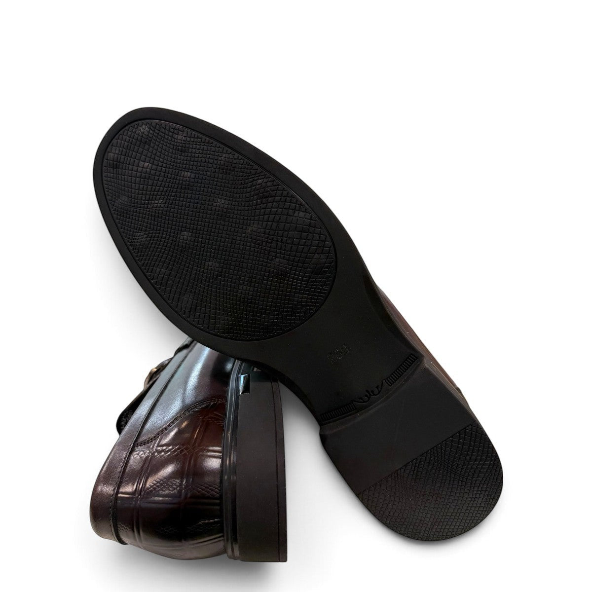 Sina Footwear dark brown genuine leather loafer with a textured croc-effect vamp and metallic buckle detail.
 photo of the bottom side