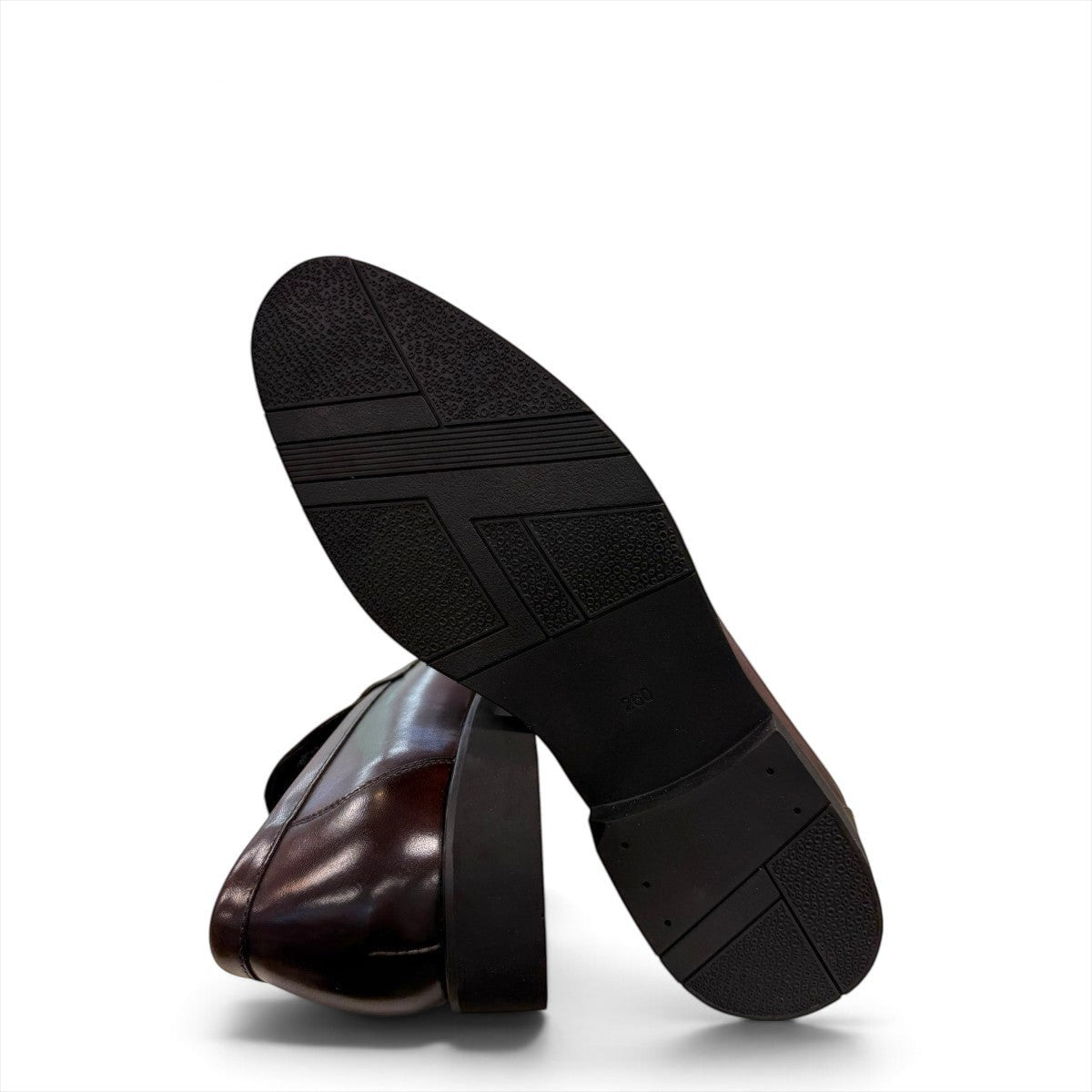 Sina Footwear dark brown genuine leather loafer with a classic silhouette, metal detail, and durable rubber outsole.
photo of the bottom side