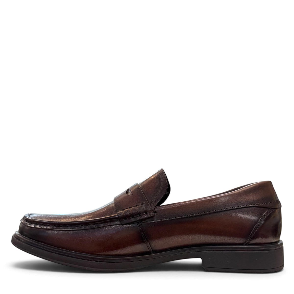 Sina Footwear dark brown genuine leather penny loafer with a classic silhouette and durable rubber outsole.
photo of the left side