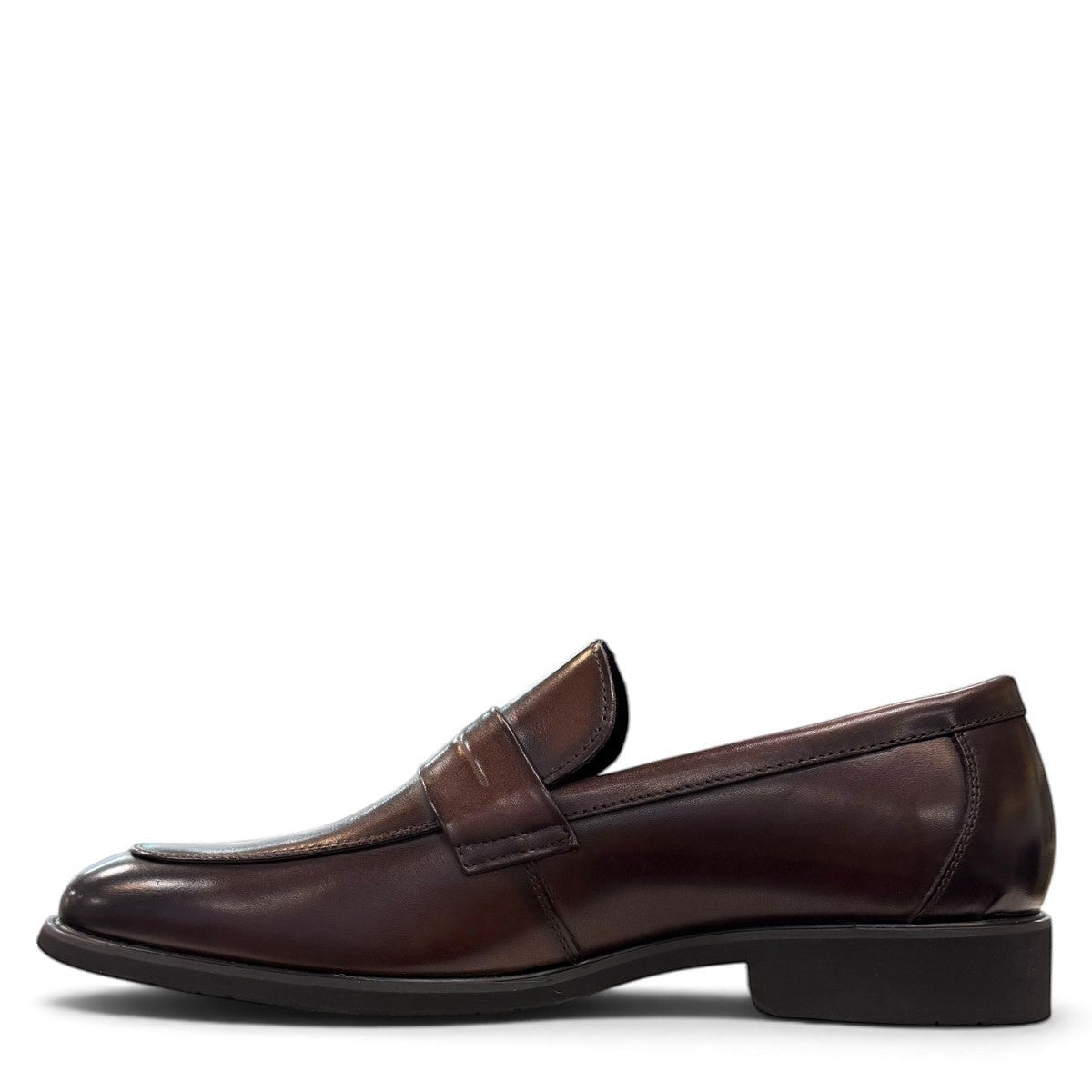 Sina Footwear dark brown genuine leather loafer with a classic silhouette, metal detail, and durable rubber outsole.
photo of the left side