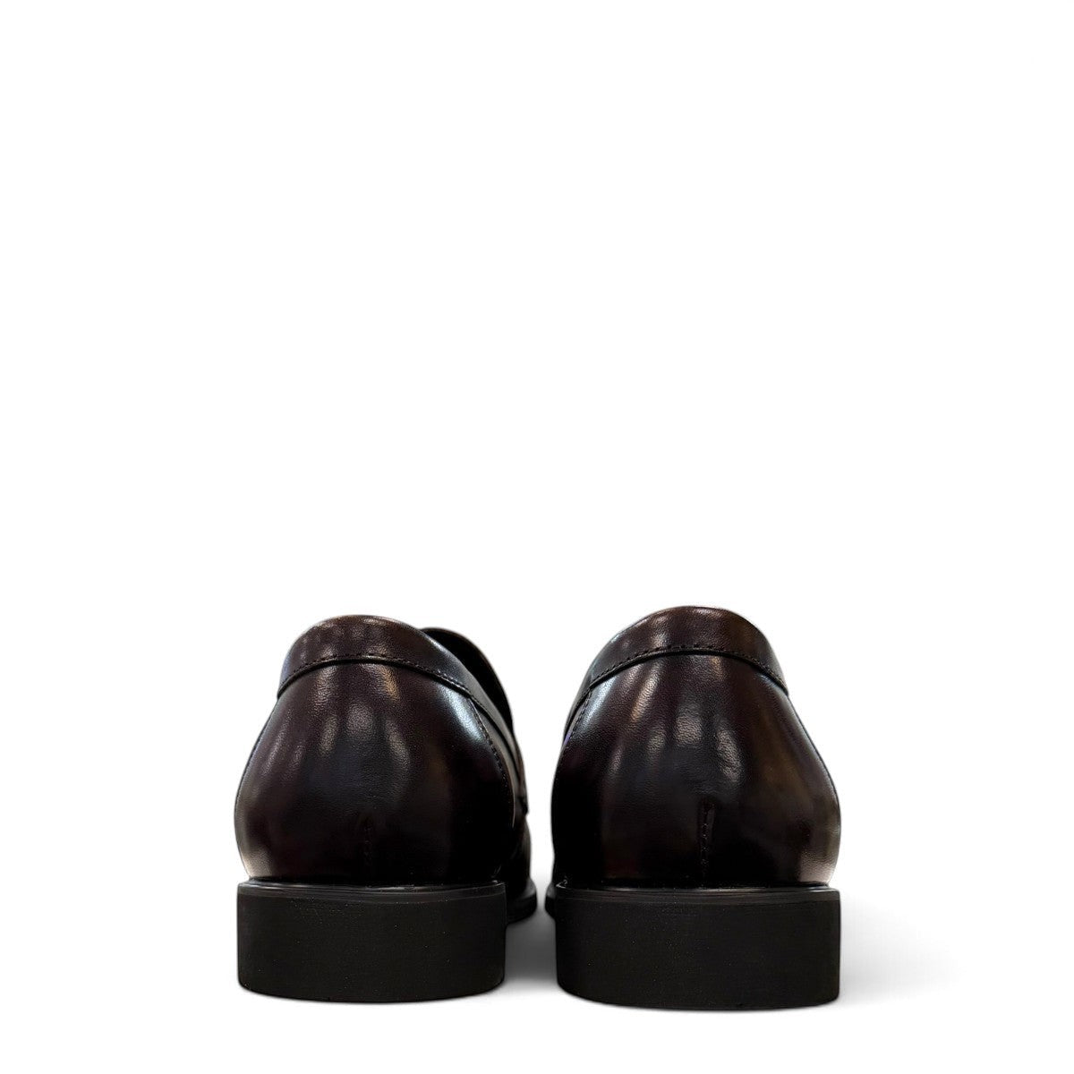 Sina Footwear dark brown genuine leather loafer with a classic silhouette, metal detail, and durable rubber outsole.
photo of the back side