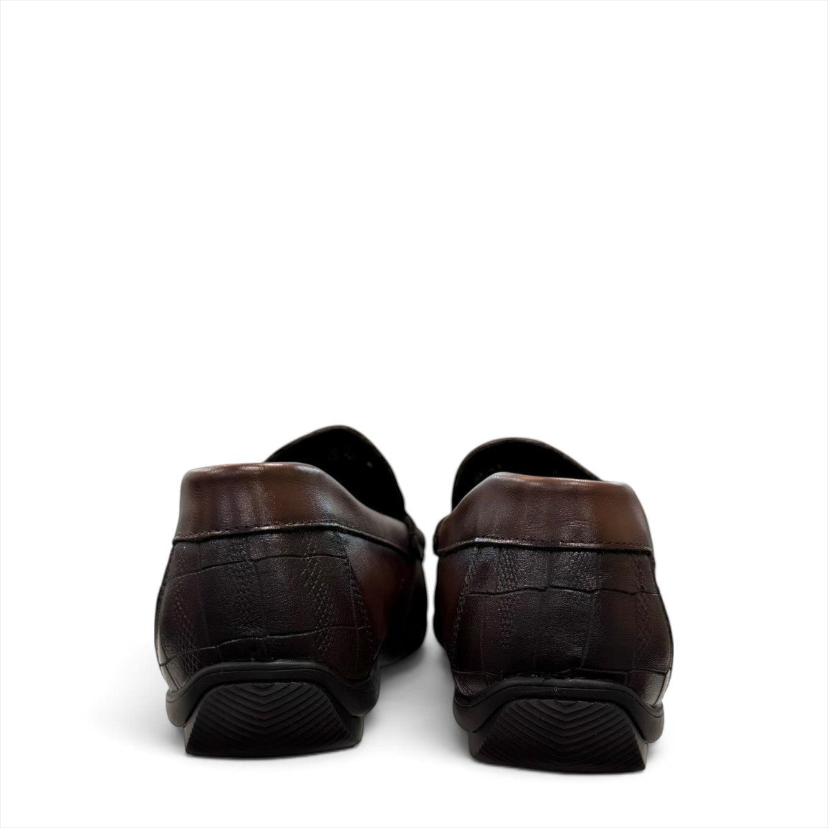Sina Footwear dark brown genuine leather loafer with crocodile-embossed detail and a durable rubber outsole.
photo of the back side