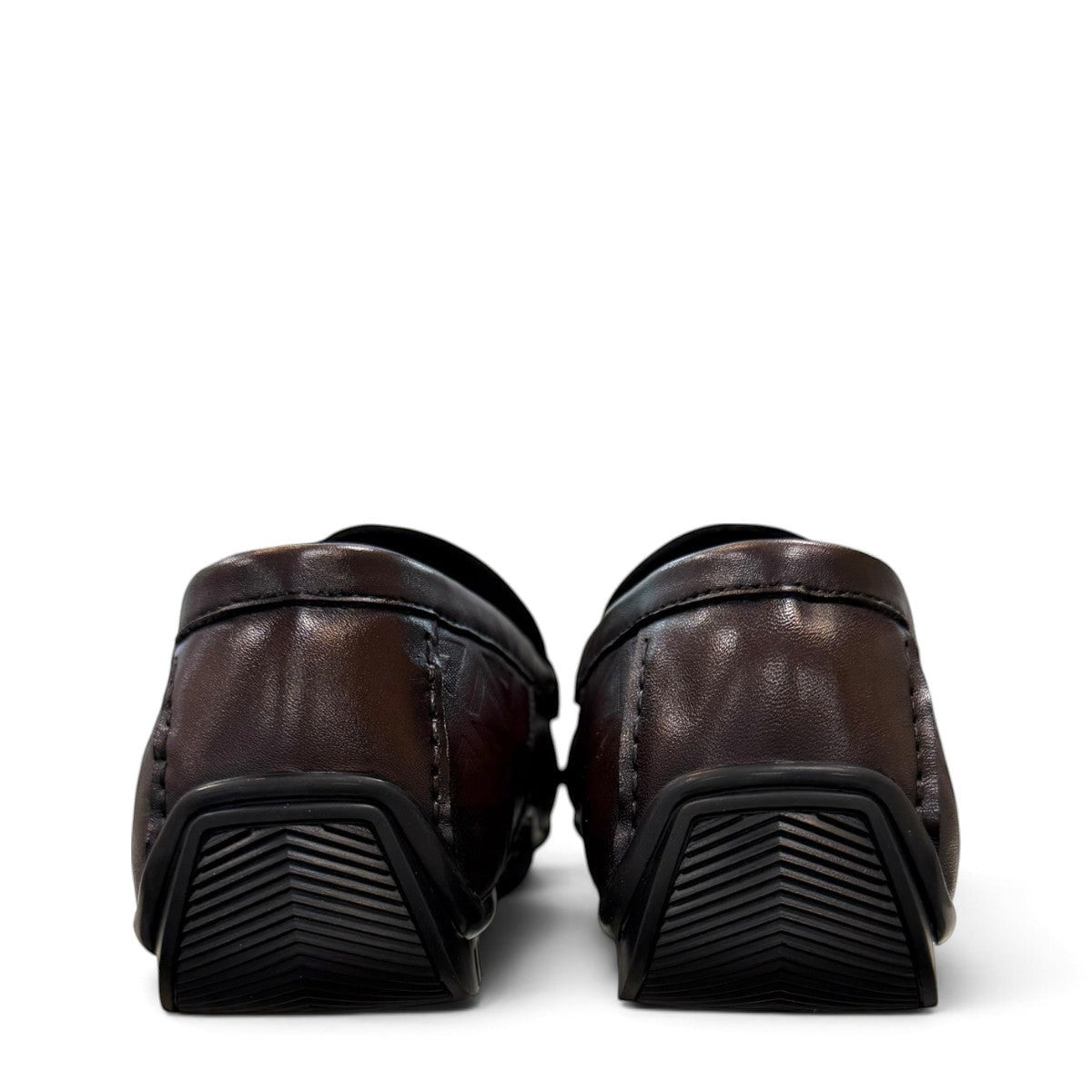 Sina Footwear dark brown genuine leather loafer with embossed geometric pattern and durable rubber outsole.
photo of the back side