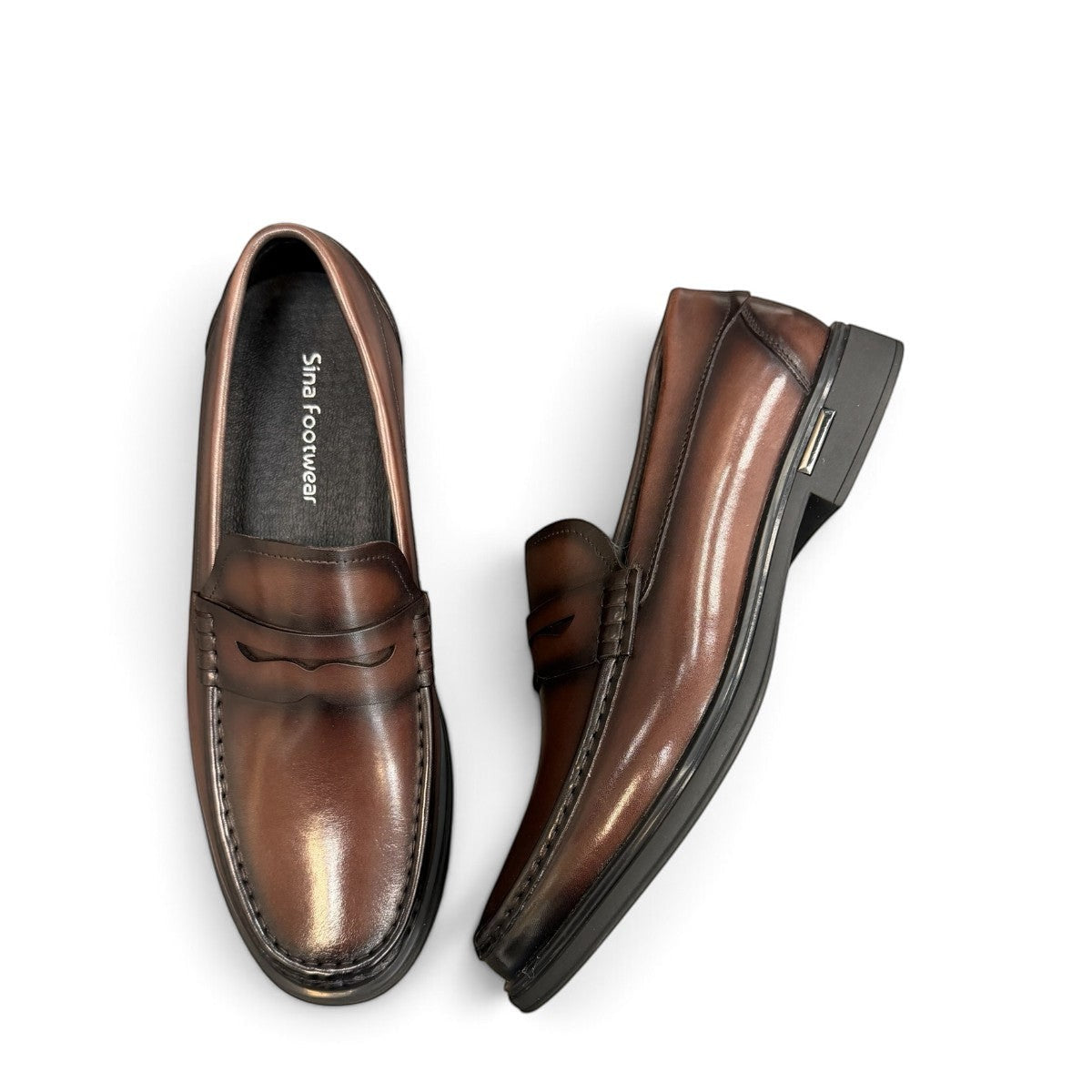 Sina Footwear dark brown genuine leather penny loafer with a classic silhouette and durable rubber outsole.
photo of the top side
