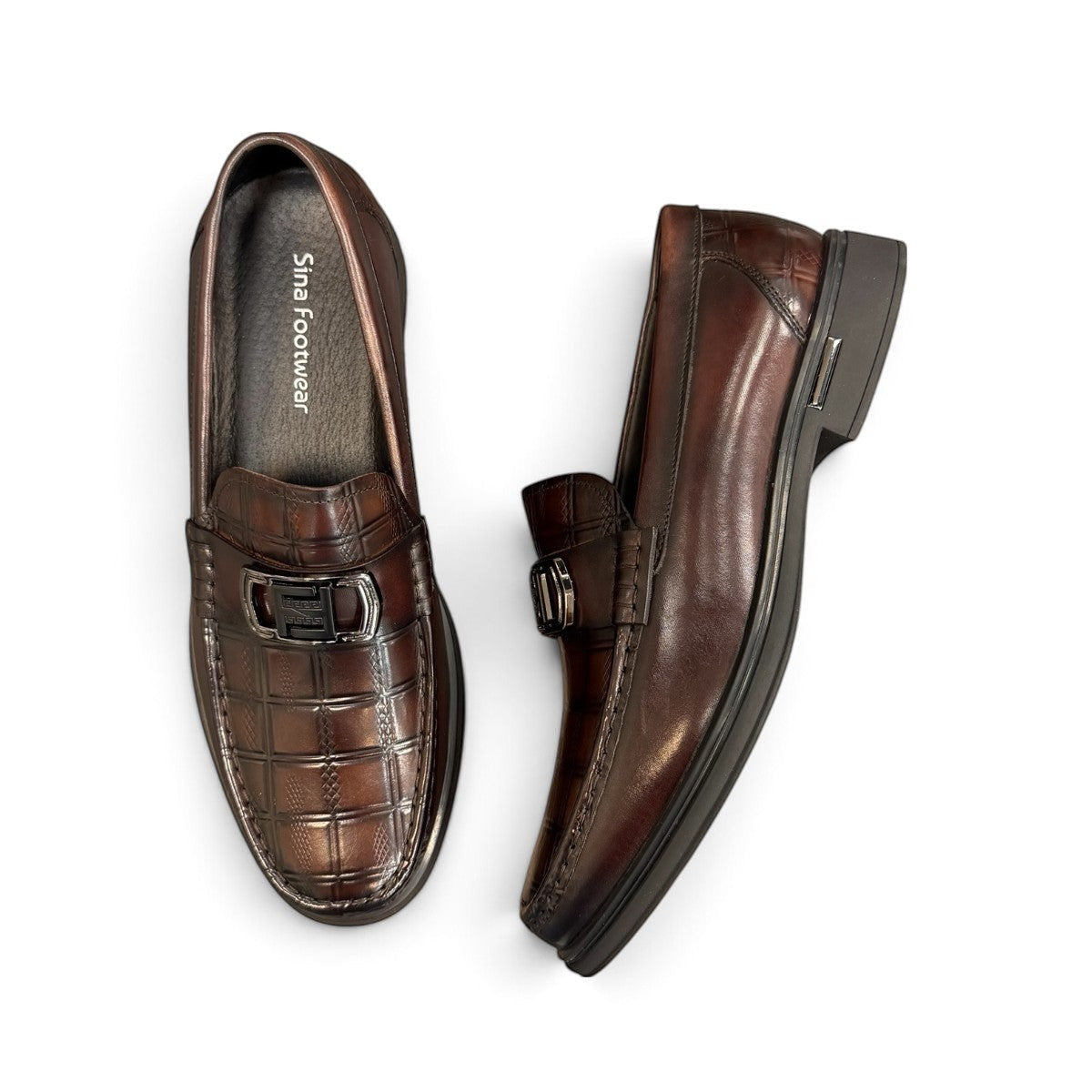 Sina Footwear dark brown genuine leather loafer with a textured croc-effect vamp and metallic buckle detail.
 photo of the top side