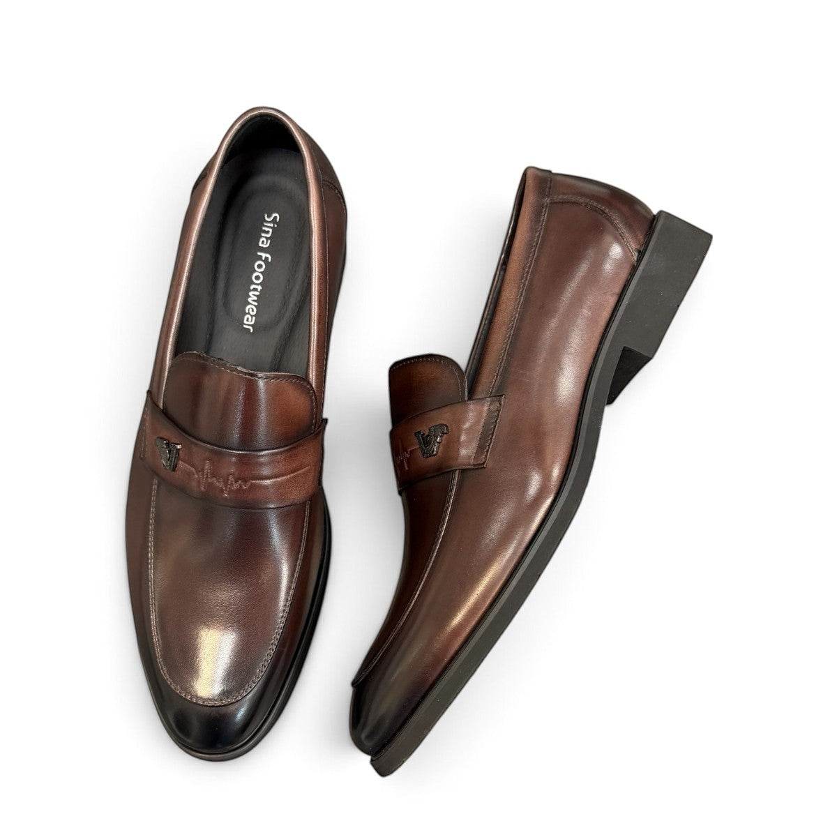 Sina Footwear dark brown genuine leather loafer with a classic silhouette, metal detail, and durable rubber outsole.
photo of the top side