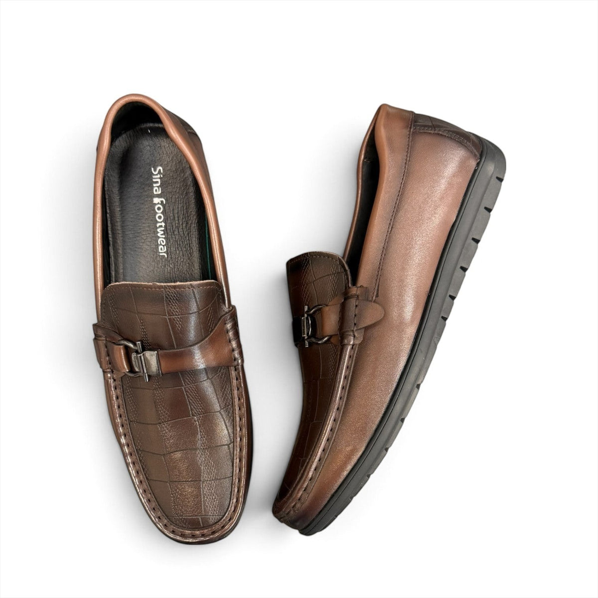 Sina Footwear dark brown genuine leather loafer with crocodile-embossed detail and a durable rubber outsole.
photo of the top side