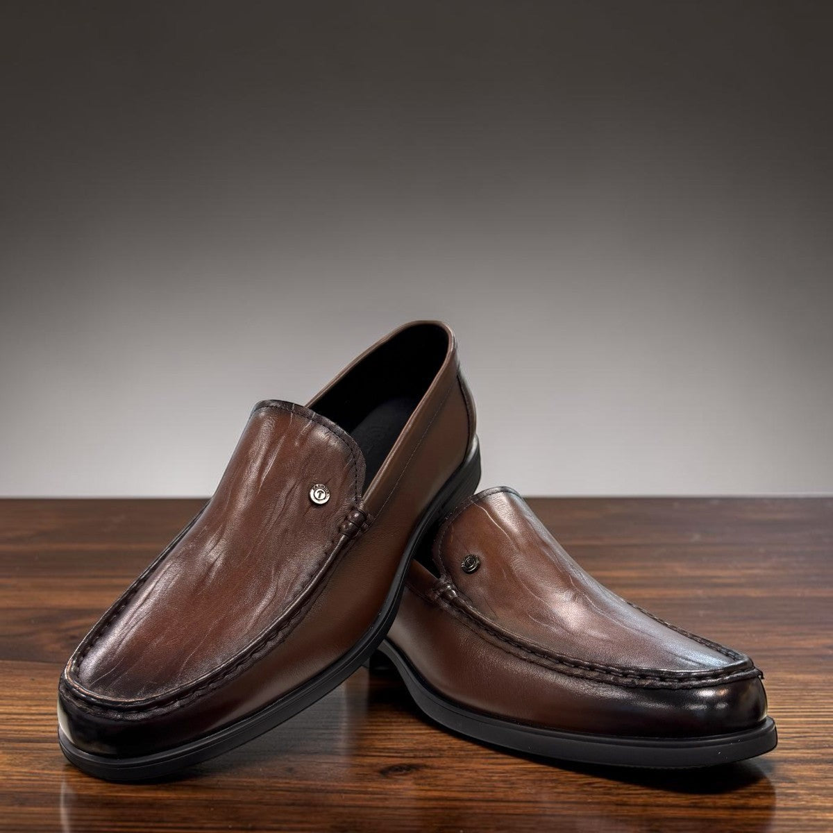 Sina Footwear dark brown genuine leather loafer with a classic slip-on design and durable rubber outsole.
photo of the front side