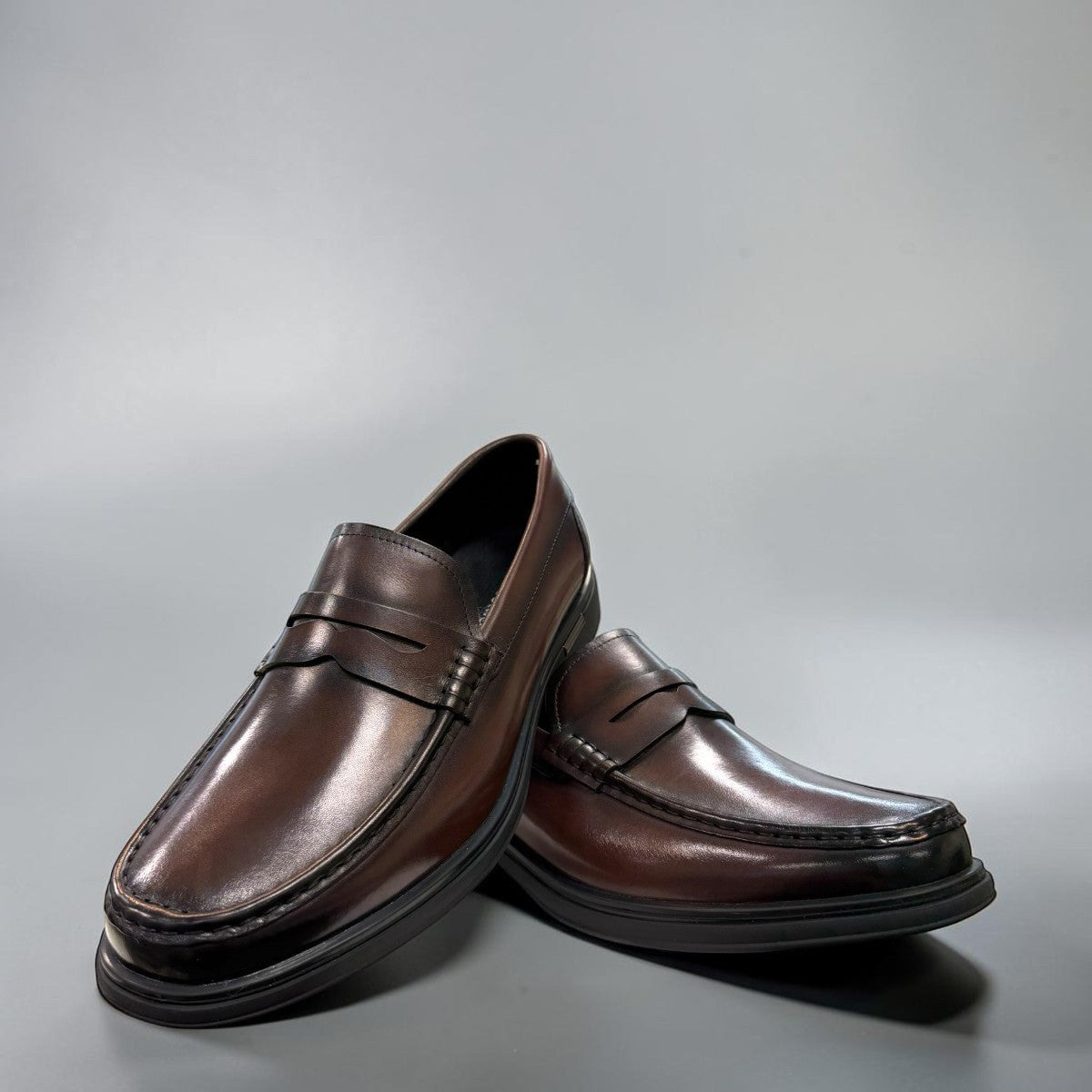 Sina Footwear dark brown genuine leather penny loafer with a classic silhouette and durable rubber outsole.
photo of the  front side