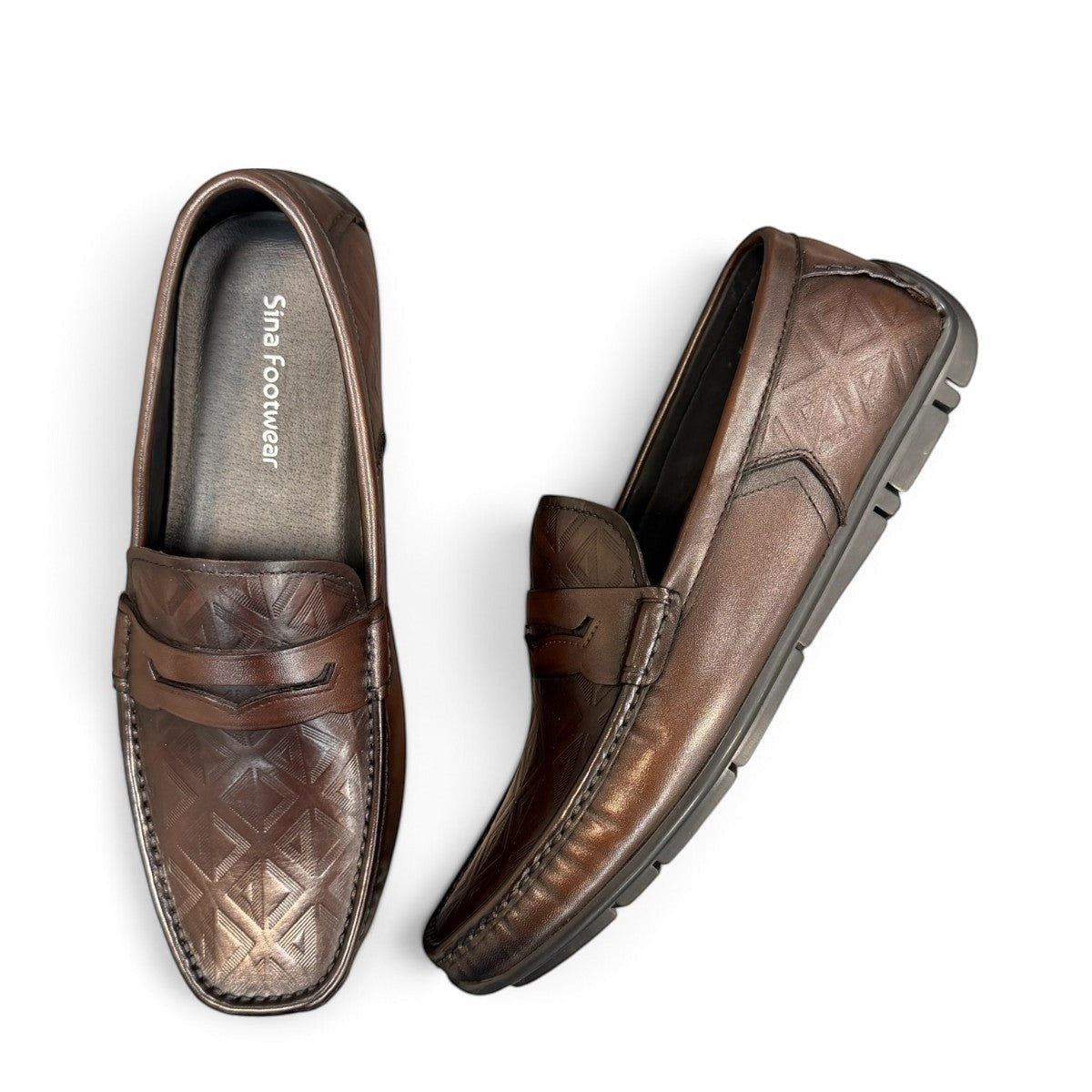 Sina Footwear dark brown genuine leather loafer with embossed geometric pattern and durable rubber outsole.
photo of the top side