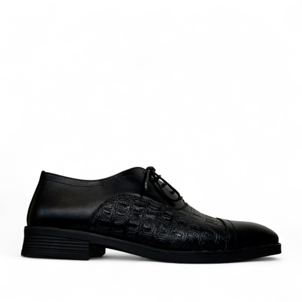 Sina Footwear Dragon black patent leather oxford shoe with textured side panel and handmade stitching detail. Photo of right side view.
