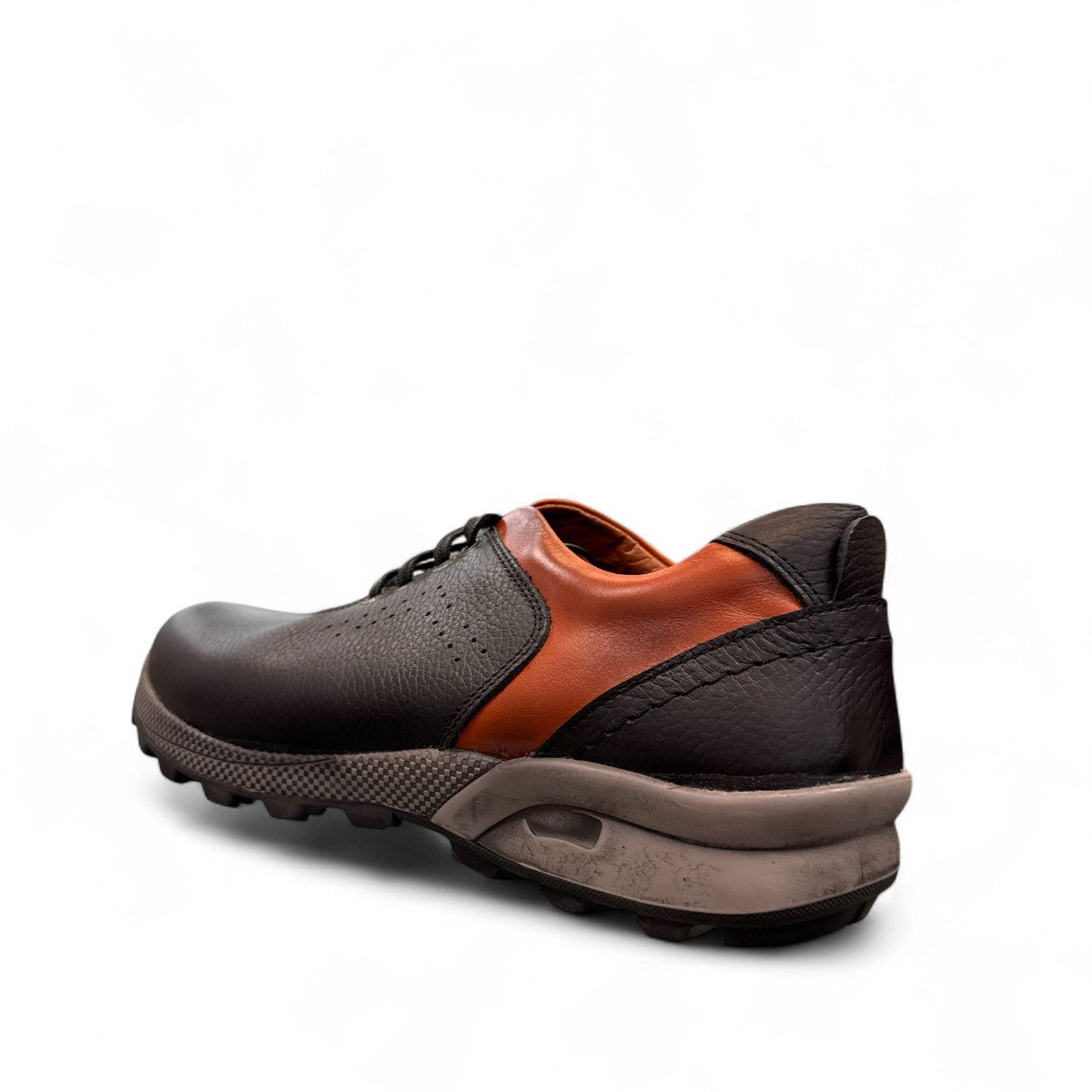 Sina Footwear Gilan black leather lace-up shoe with brown heel detail, textured rubber outsole, and side stitching. Photo of back side view.