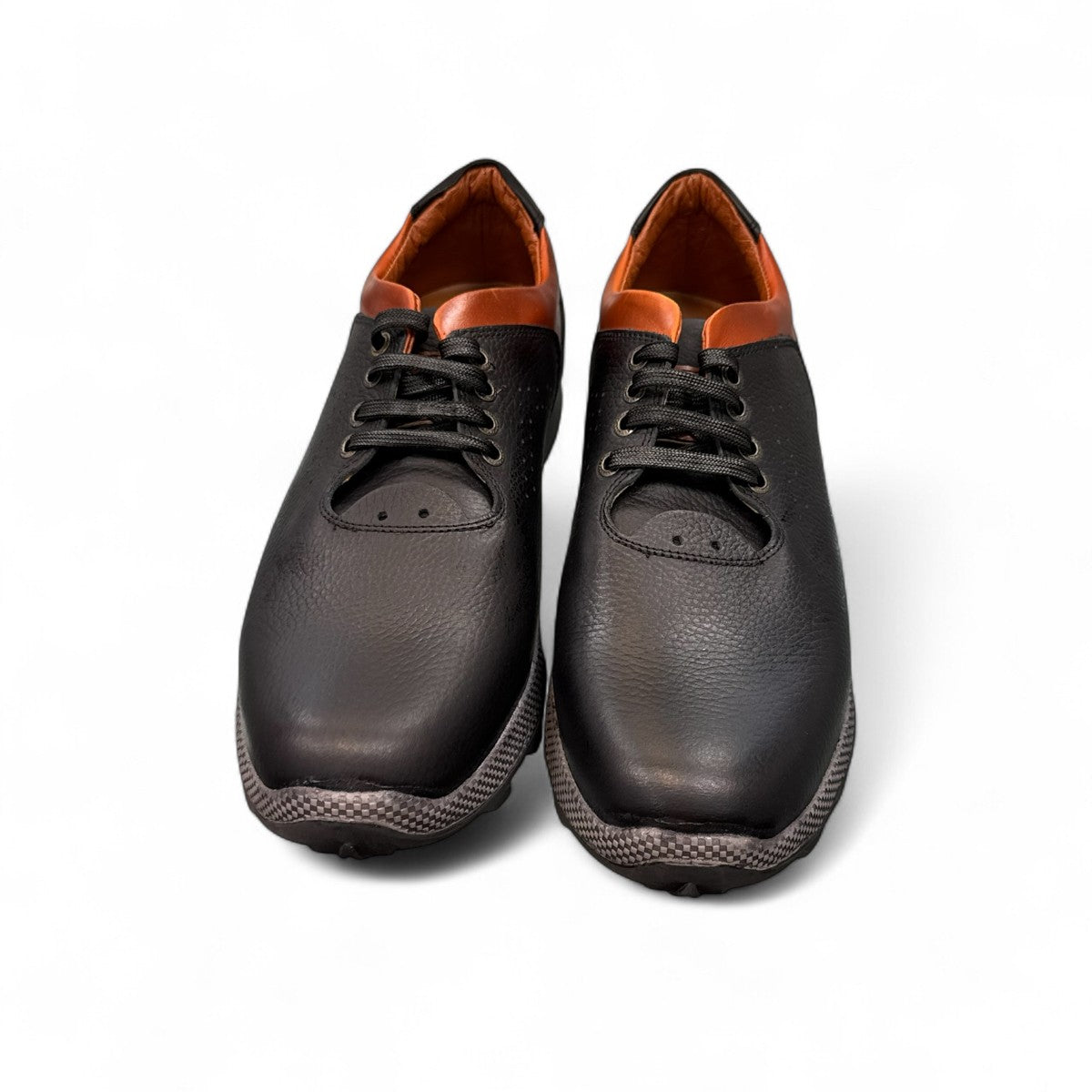 Sina Footwear Gilan black leather lace-up shoe with brown heel detail, textured rubber outsole, and side stitching. Photo of upper view.