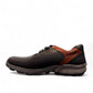 Sina Footwear Gilan black leather lace-up shoe with brown heel detail, textured rubber outsole, and side stitching. Photo of left side view.