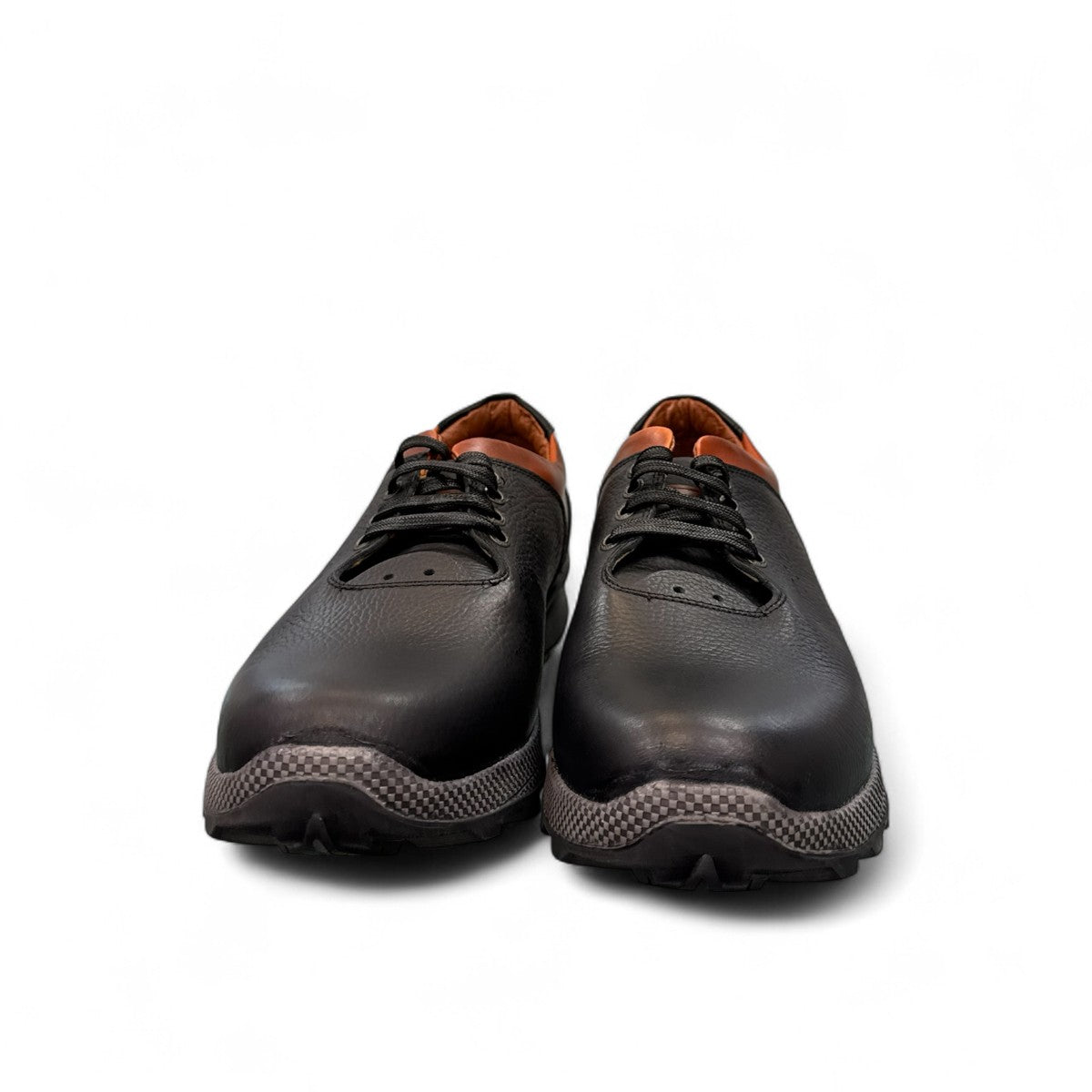 Sina Footwear Gilan black leather lace-up shoe with brown heel detail, textured rubber outsole, and side stitching. Photo of front view.