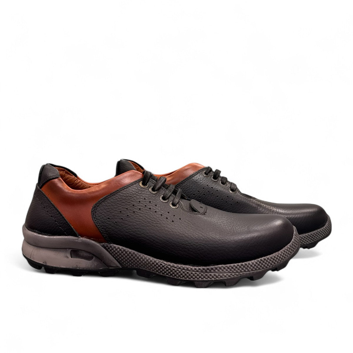 Sina Footwear Gilan black leather lace-up shoe with brown heel detail, textured rubber outsole, and side stitching. Photo of side views.