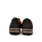 Sina Footwear Gilan black leather lace-up shoe with brown heel detail, textured rubber outsole, and side stitching. Photo of back view.