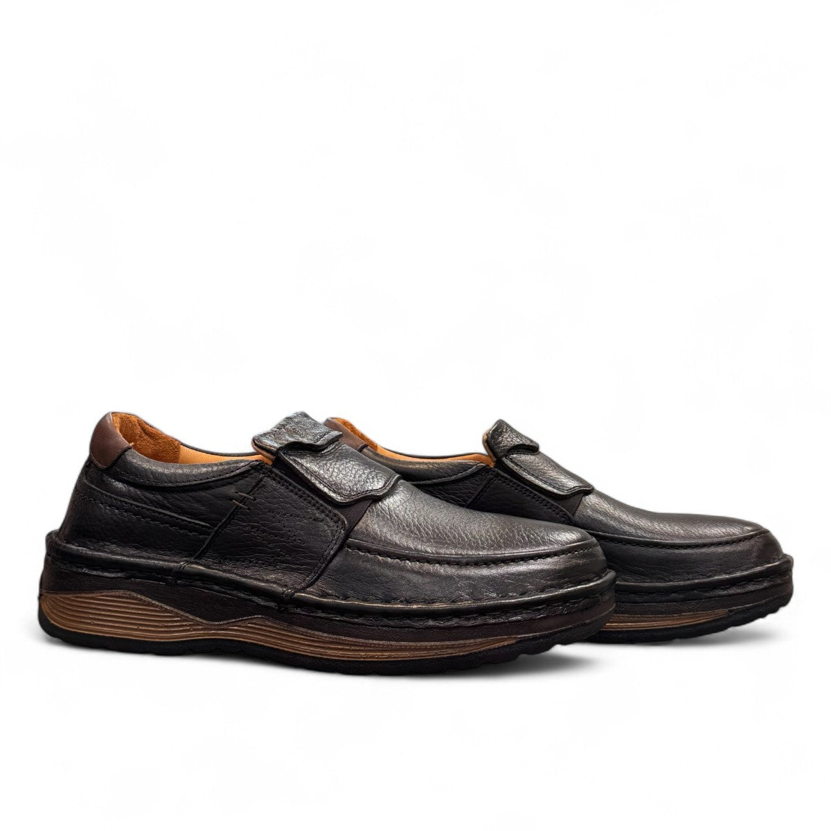 Sina Footwear Kiarash black genuine leather slip-on shoes with handmade stitching and a durable textured sole. Photo of side views.