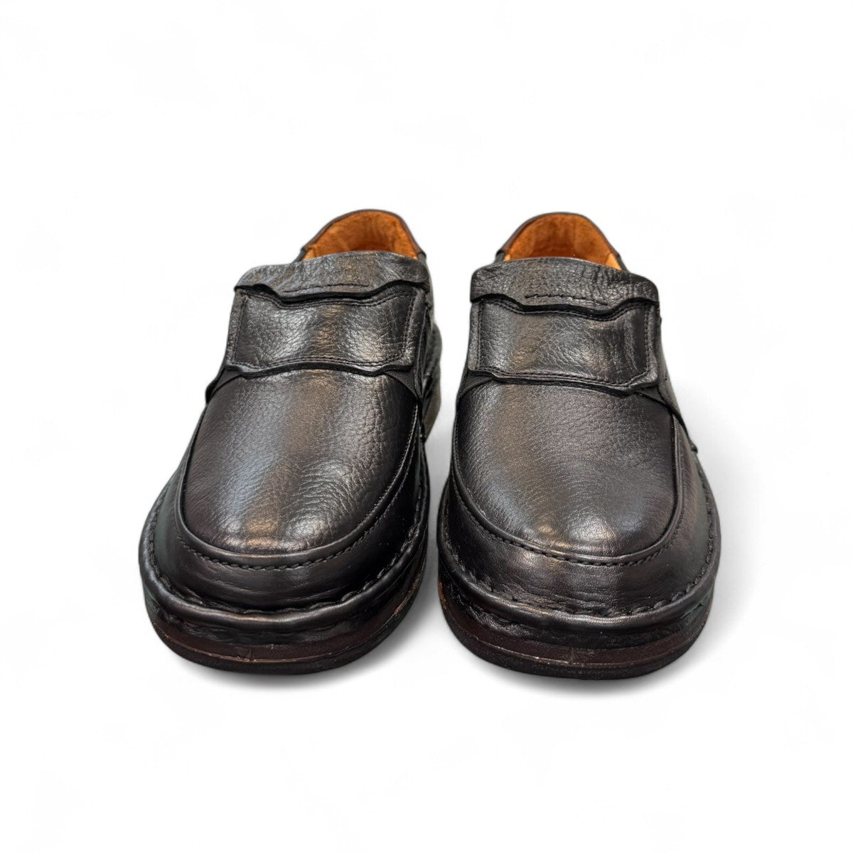 Sina Footwear Kiarash black genuine leather slip-on shoes with handmade stitching and a durable textured sole. Photo of front view.