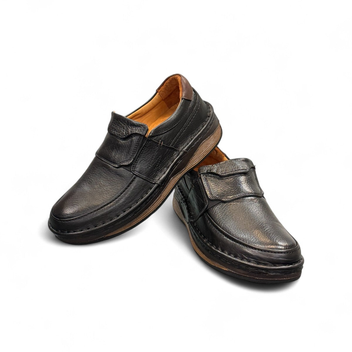 Sina Footwear Kiarash black genuine leather slip-on shoes with handmade stitching and a durable textured sole. Photo of upper view.