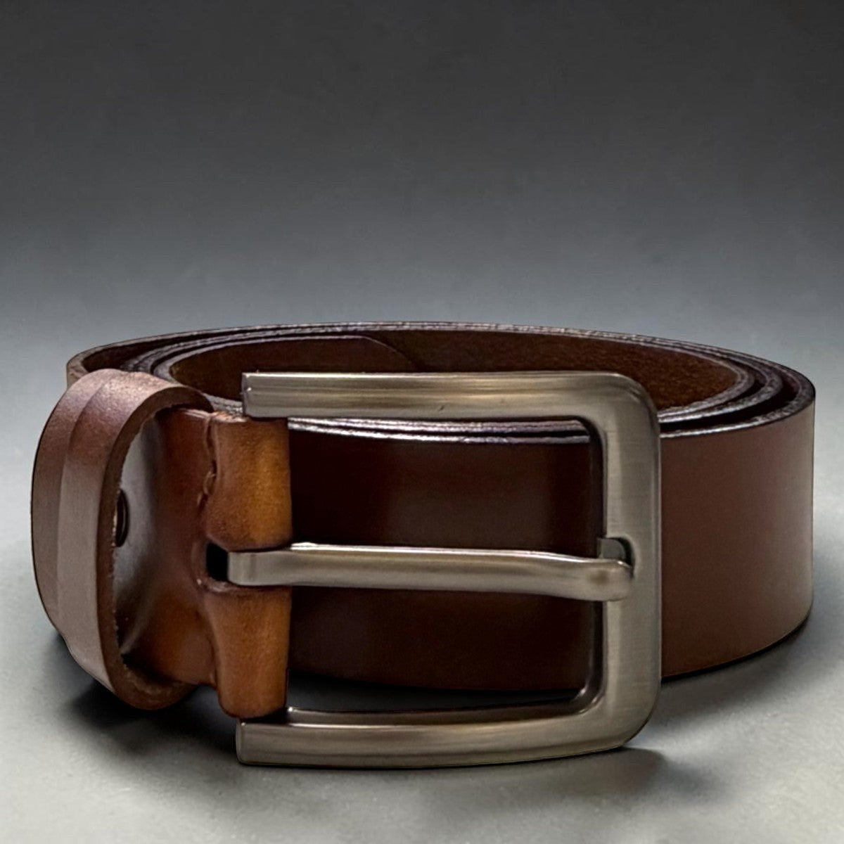 Sina Footwear men's genuine leather belt in rich brown with a sleek silver buckle. Perfect for formal or everyday wear.