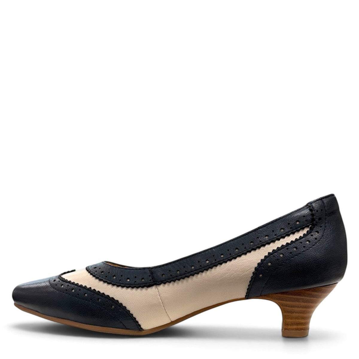 Sina Footwear navy blue and off-white leather pumps with brogue detailing, pointed toe, and low block heel.
photo of the left side