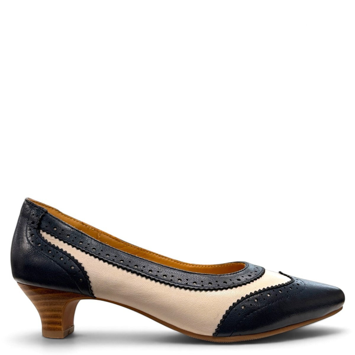 Sina Footwear navy blue and off-white leather pumps with brogue detailing, pointed toe, and low block heel.
photo of the right side