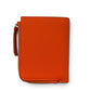 Sina Footwear genuine leather bi-fold wallet in vibrant orange with a zippered coin pocket and textured finish.