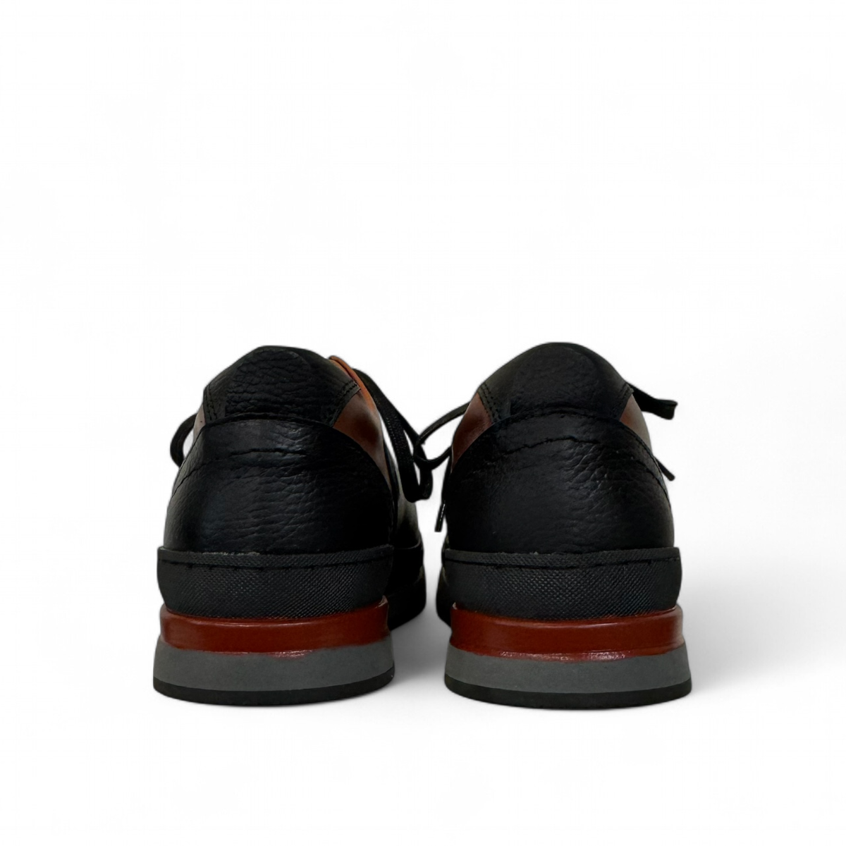 Sina Footwear Pasargad black leather lace-up sneakers with brown accents and a durable rubber outsole. Photo of back view.