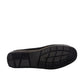 Sina Footwear Poonak black suede loafers with handmade stitching and a metallic bit detail on a white background. Photo of bottom view.