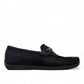 Sina Footwear Poonak black suede loafers with handmade stitching and a metallic bit detail on a white background. Photo of right side view.
