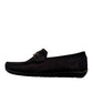 Sina Footwear Poonak black suede loafers with handmade stitching and a metallic bit detail on a white background. Photo of left side view.