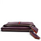 Sina Footwear genuine leather wallet in purple with red and blue stripe detail and zippered compartments.
