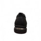 Sina Footwear Satel black genuine leather slip-on shoe with textured upper, rubber outsole, and handmade stitching. Photo of back view.