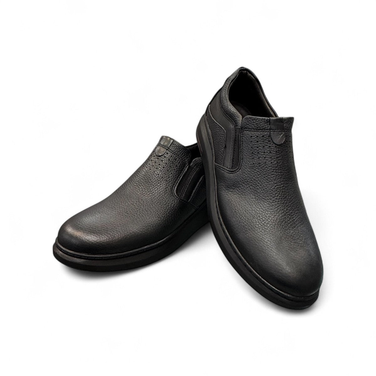 Sina Footwear Satel black genuine leather slip-on shoe with textured upper, rubber outsole, and handmade stitching. Photo of upper view.