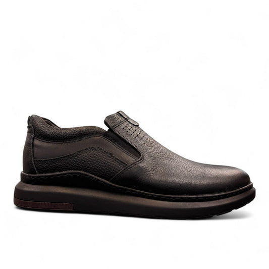 Sina Footwear Satel black genuine leather slip-on shoe with textured upper, rubber outsole, and handmade stitching. Photo of right side view.