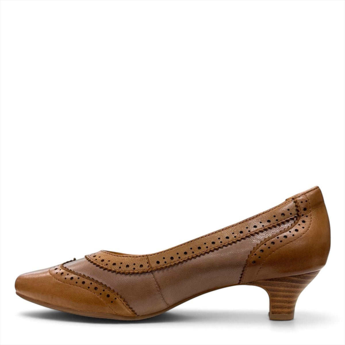 Sina Footwear tan leather pump with pointed toe, brogue-inspired perforated details, and a low block heel.
photo of the left side